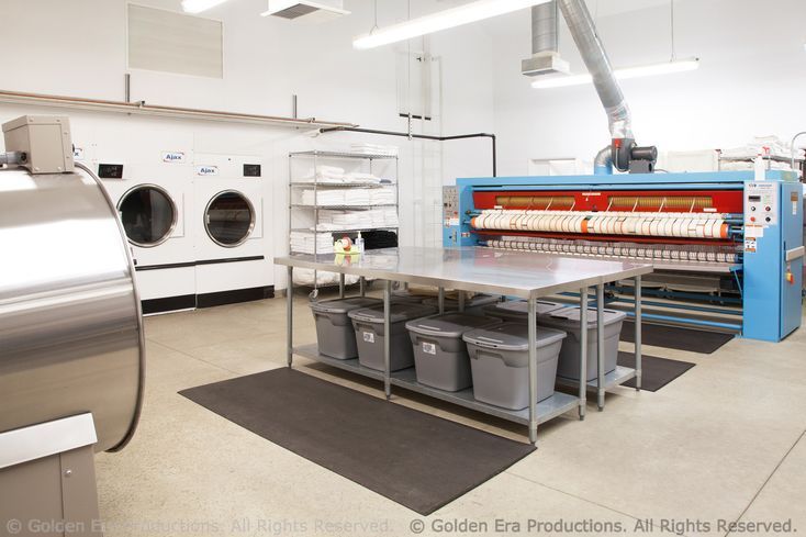 Egyptian cotton bed linens are laundered and pressed for Golden Era staff and visitors in this laundry facility located on the property.