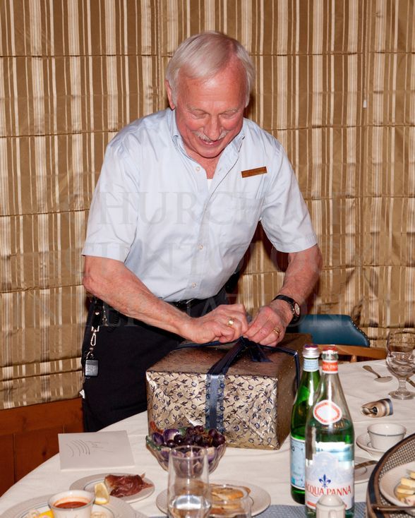 Ron Miscavige unwrapping a birthday gift from his son, Mr. David Miscavige, January 2011.