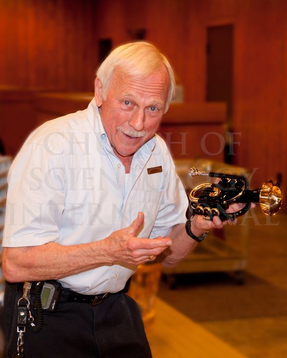 Ron Miscavige shows off his Jupiter Pocket Trumpet given to him by Mr. David Miscavige for his 75th birthday.